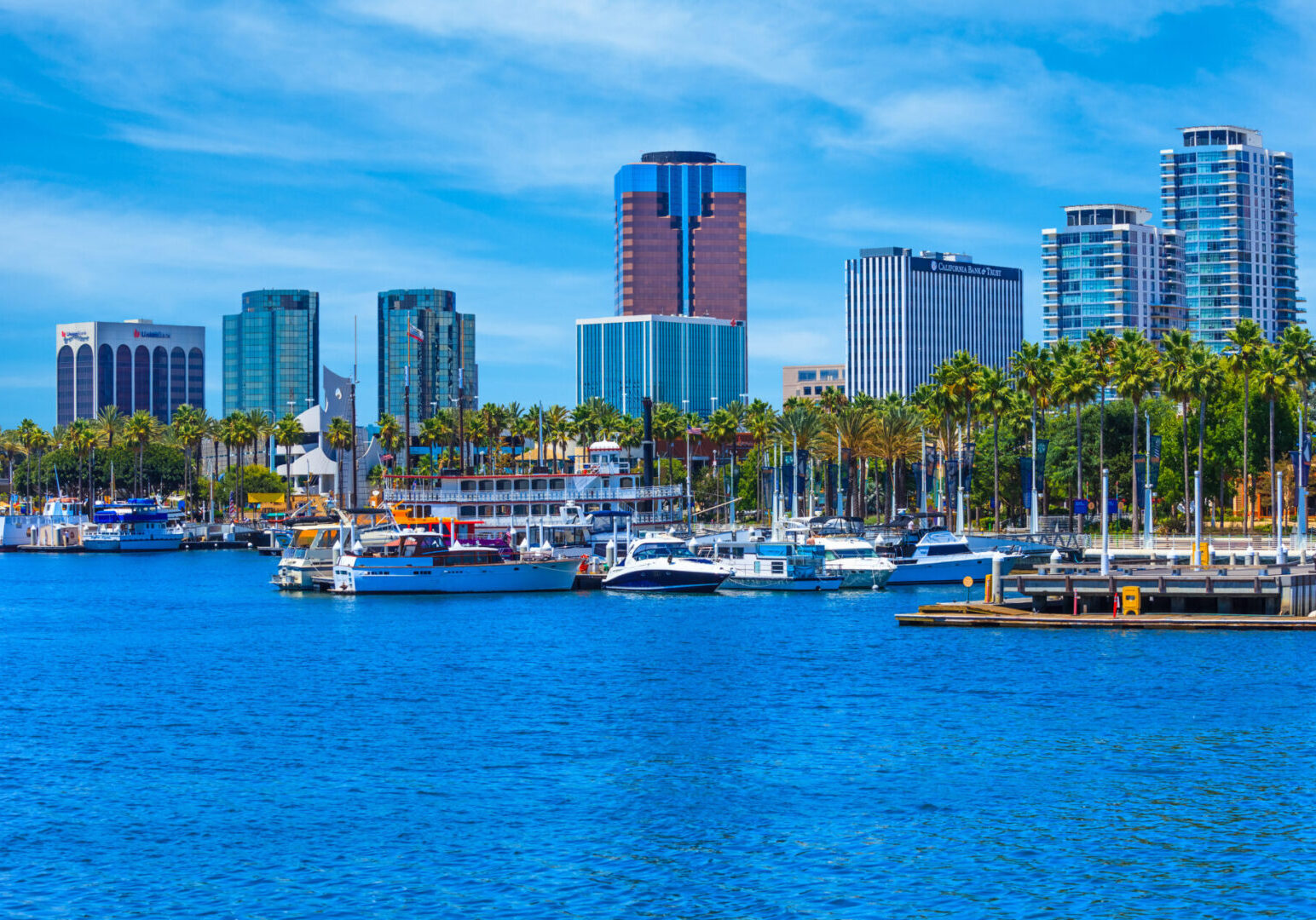 Rainbow Harbor at Long Beach Marina with city skyline, California